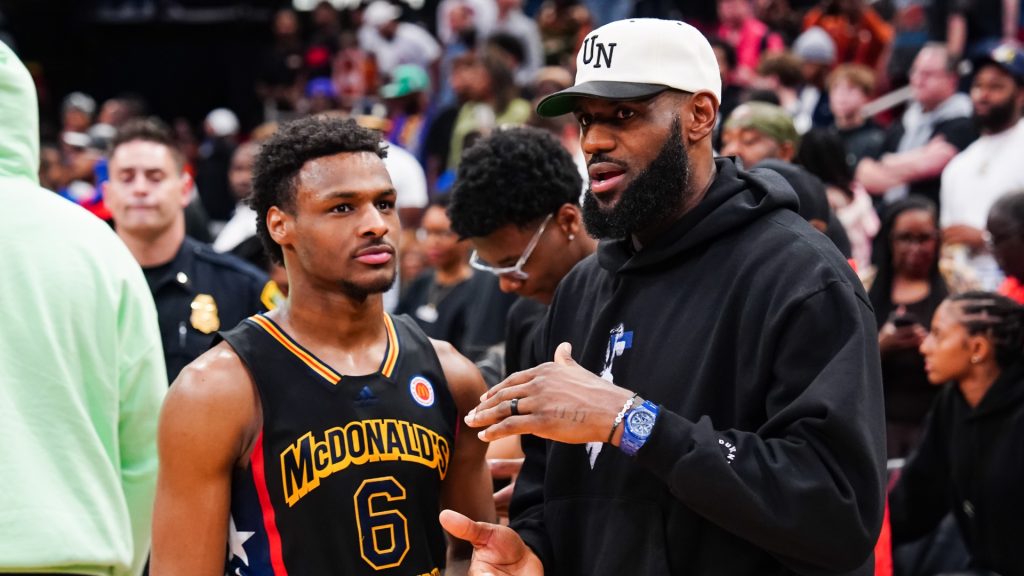 Bronny James #6 of the West team talks to LeBron James of the Los Angeles Lakers after the 2023 McDonald’s High School Boys All-American Game at Toyota Center on March 28, 2023 in Houston, Texas.