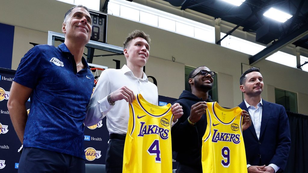 Rob Pelinka, Dalton Knecht, Bronny James and JJ Redick of the Los Angeles Lakers pose for a photo after a press conference at UCLA Health Training Center on July 02, 2024 in El Segundo, California.