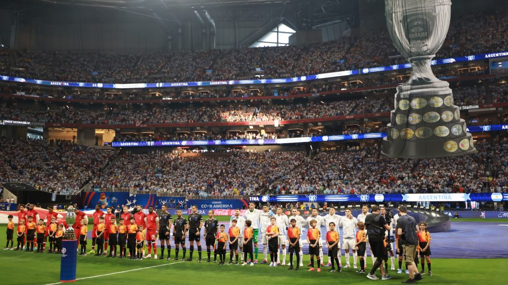 Players of Canada and Argentina line up for the national anthem prior to durin the CONMEBOL Copa America group A match between Argentina and Canada at Mercedes-Benz Stadium on June 20, 2024 in Atlanta, Georgia.