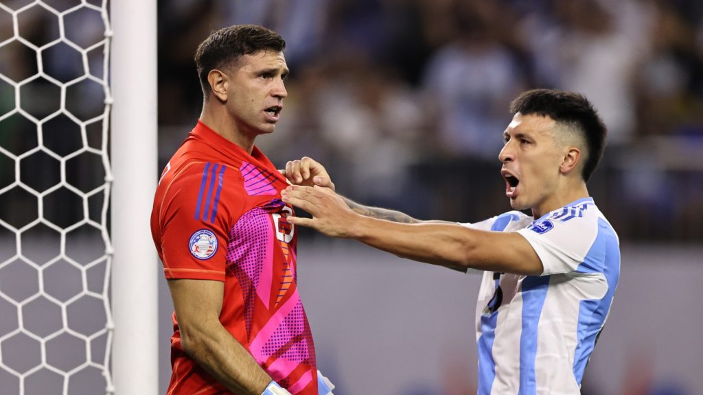 Emiliano Martinez and Lisandro Martinez of Argentina react after a missed penalty from Ecuador during the CONMEBOL Copa America 2024 quarter-final match between Argentina and Ecuador at NRG Stadium on July 04, 2024 in Houston, Texas.