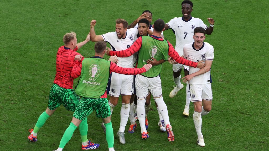 Jude Bellingham of England (CR) celebrates with teammates after scoring his team’s first goal during the UEFA EURO 2024 round of 16 match between England and Slovakia. Photo by Dean Mouhtaropoulos/Getty Images