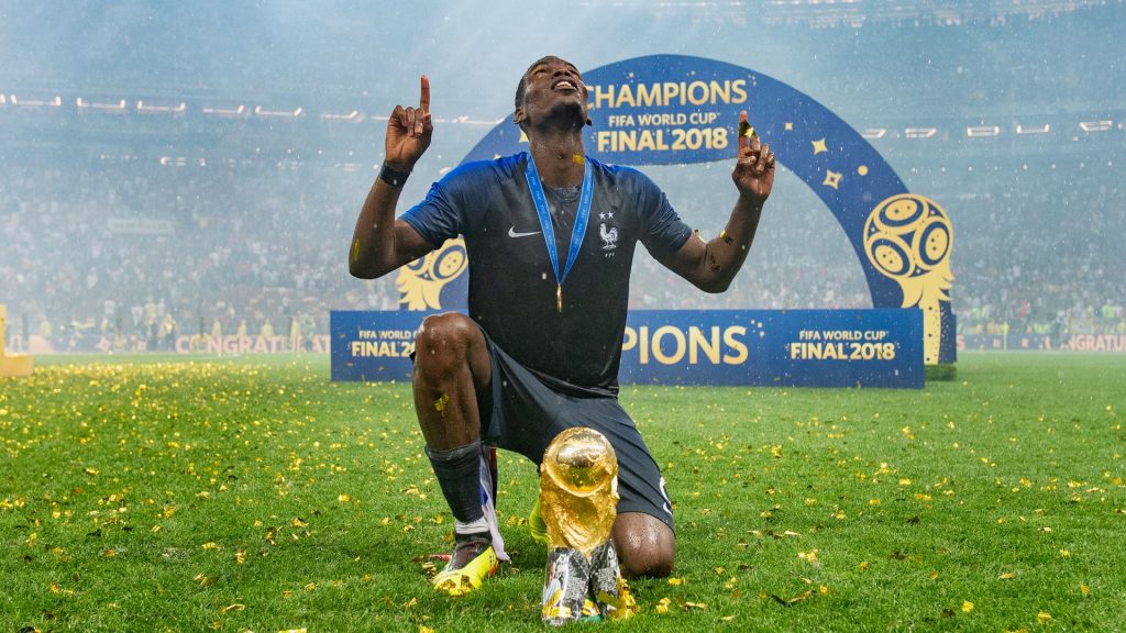 Paul Pogba of France celebrates with the World Cup Trophy following his sides victory in the 2018 FIFA World Cup Final. Photo by Matthias Hangst/Getty Images